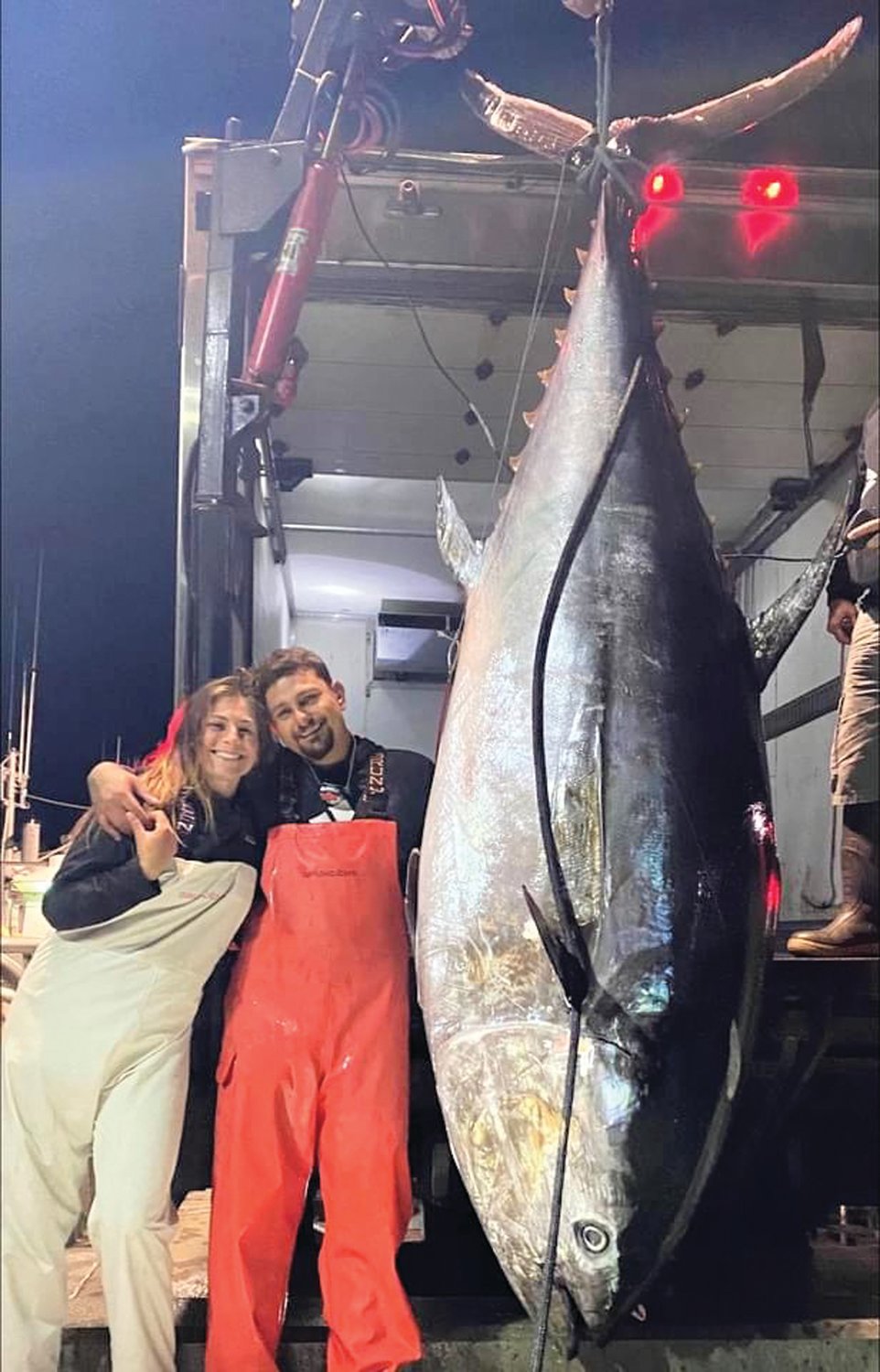 CATCH OF A LIFETIME: Jenna Lombardo and Brandon Hagopian, both of Cranston, with the 1,000 bluefin tuna they caught off Cape Cod this Sunday. (Submitted photo)